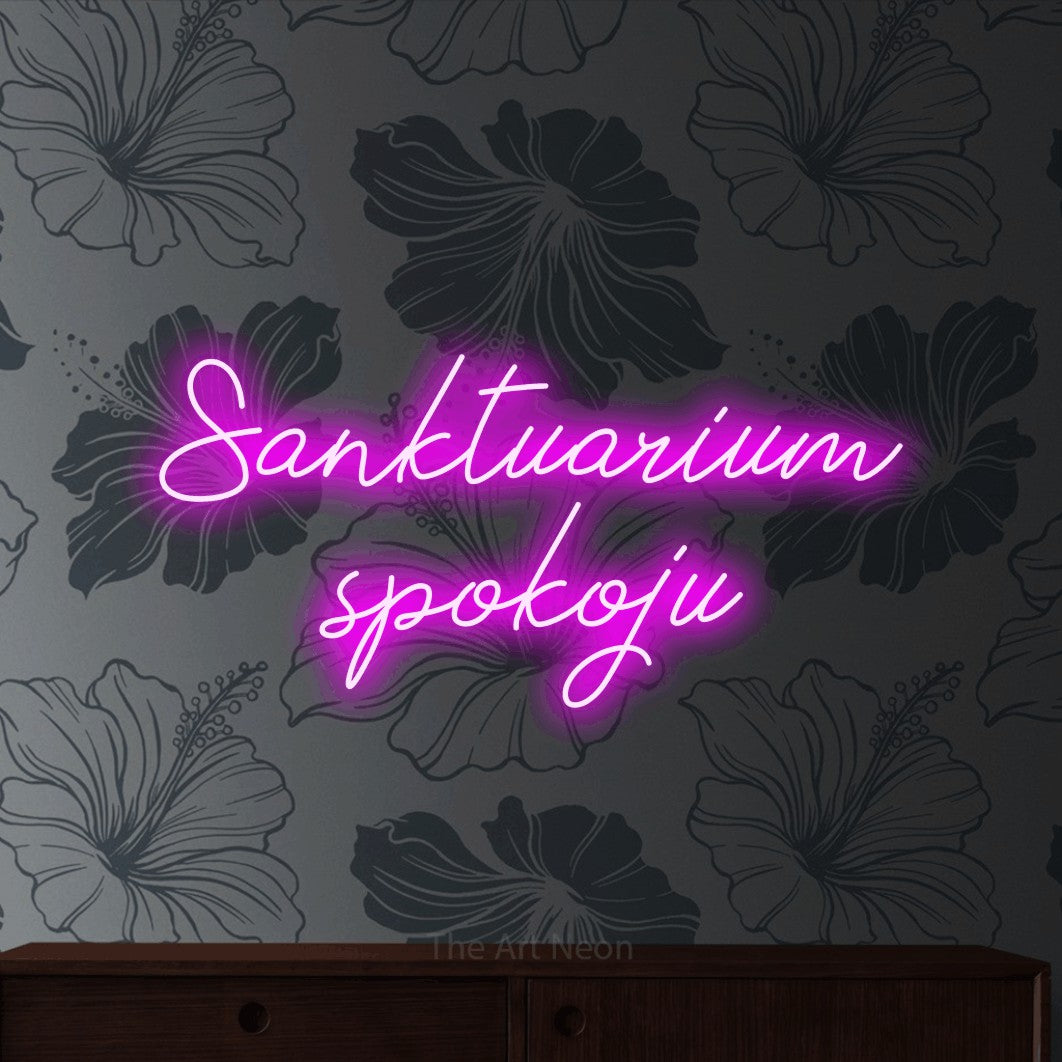 LED neon sign reading “Sanktuarium spokoju”, arranged in two lines.