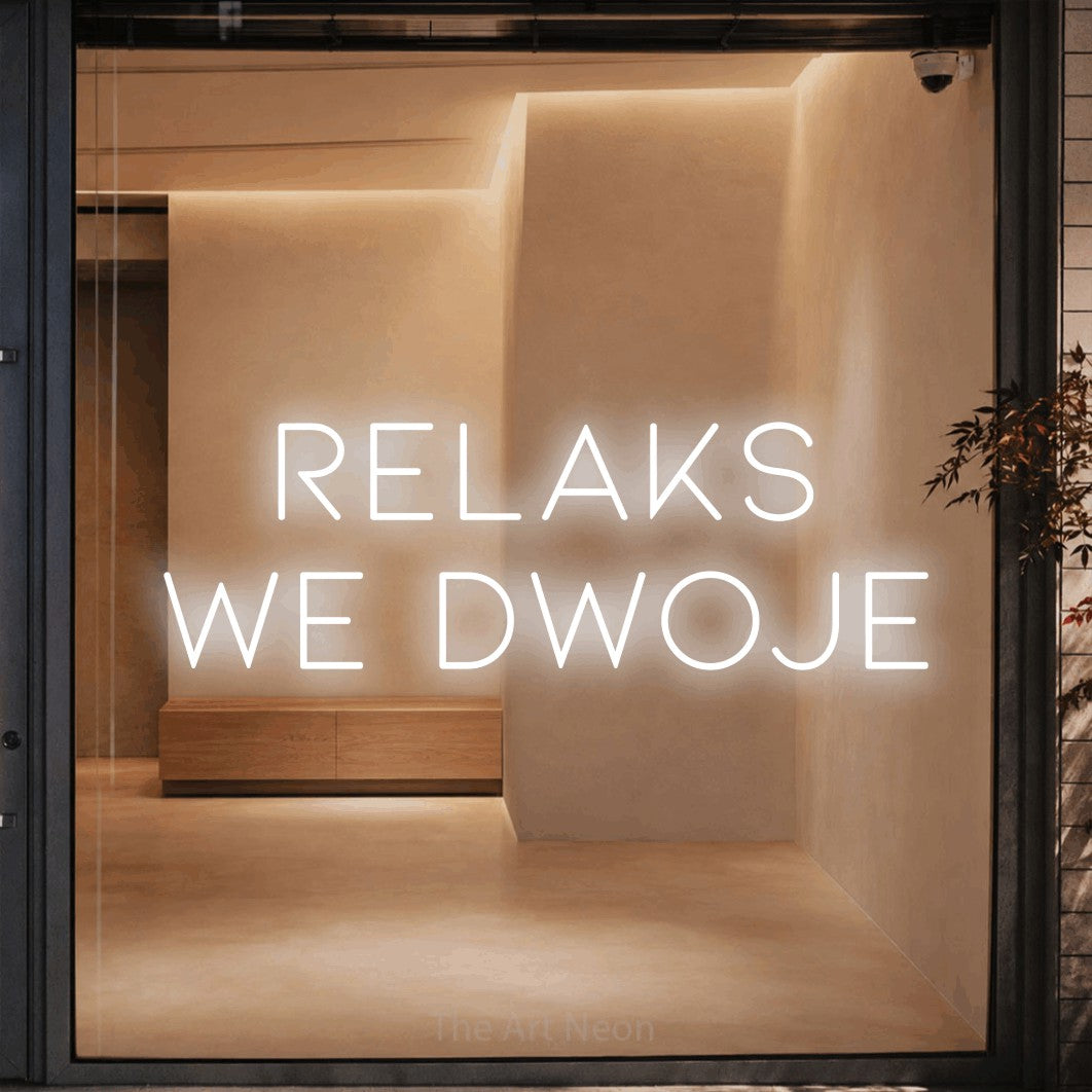 LED neon sign reading “RELAKS we dwoje”, arranged in two lines.