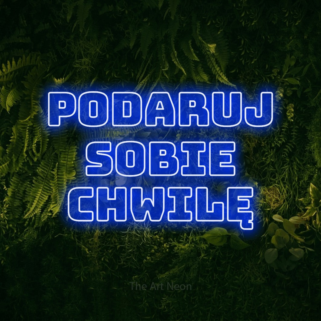 LED neon sign reading “Podaruj sobie chwilę”, arranged in three lines.