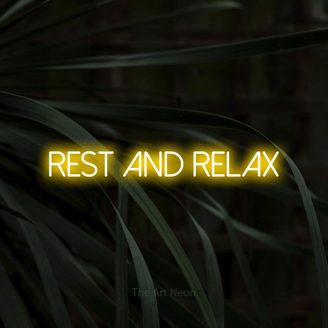 LED neon sign reading “rest and relax”, arranged in a single line.