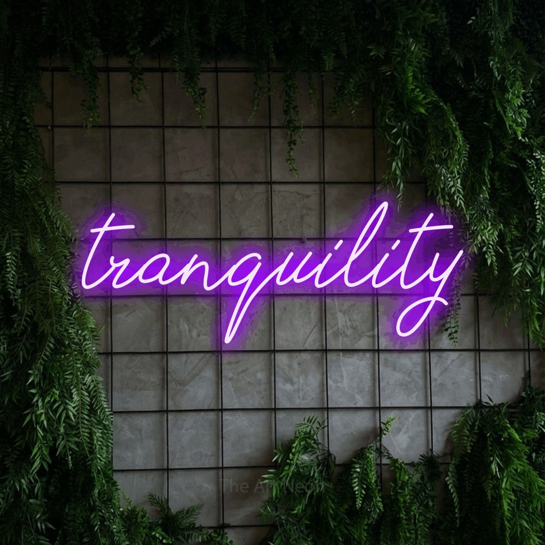 LED neon sign reading “tranquility”, arranged in a single line.