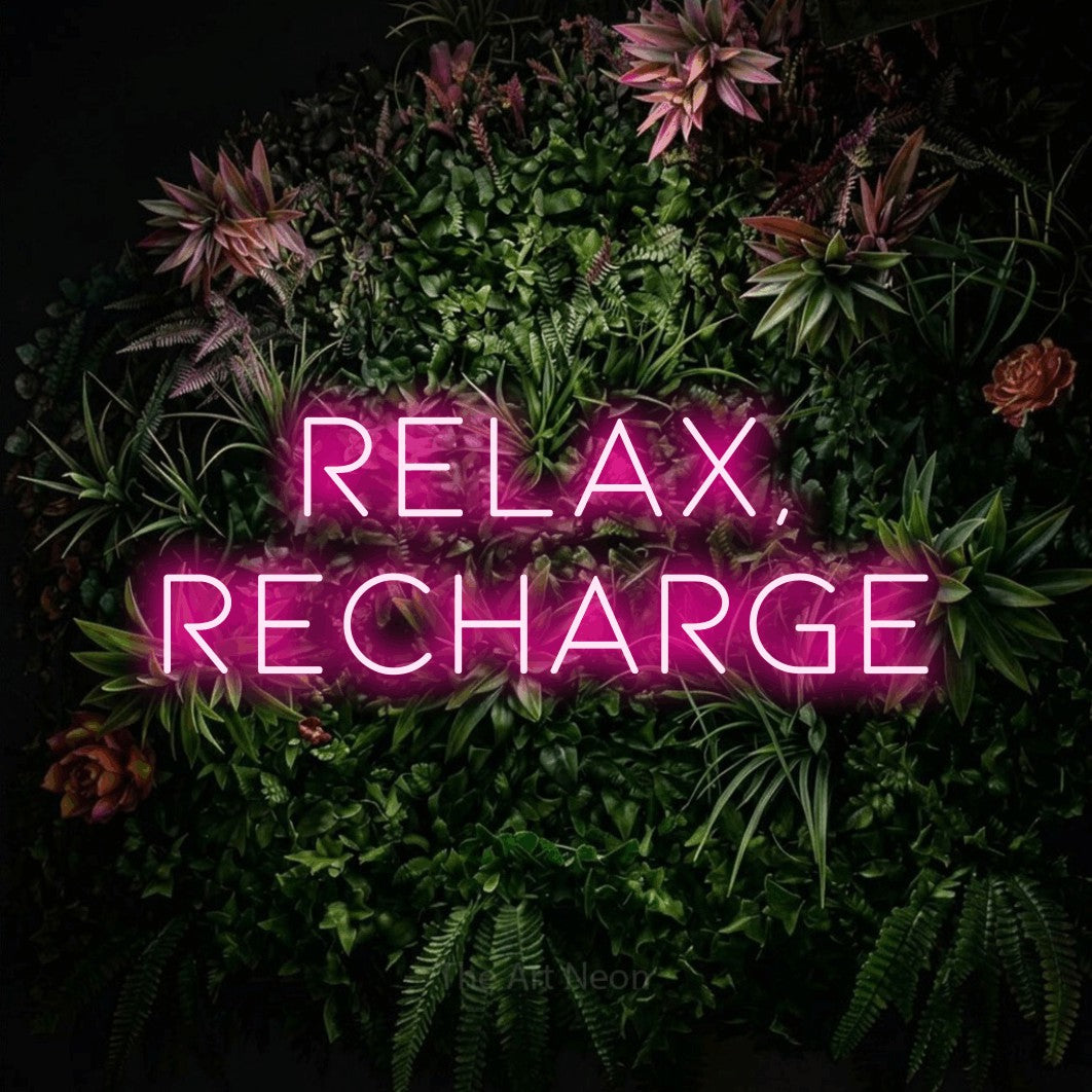 LED neon sign reading “Relax, Recharge”, arranged in two lines.
