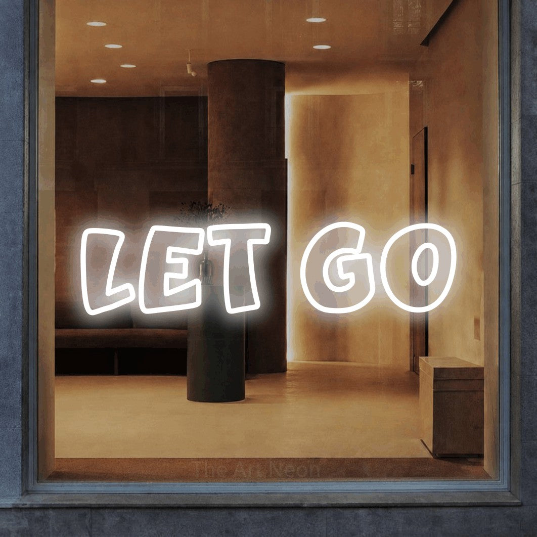 LED neon sign reading “Let Go”, arranged in a single line.