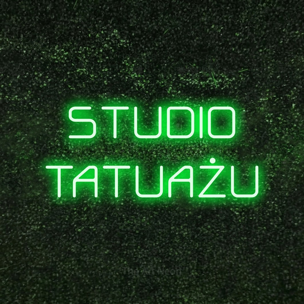LED neon sign reading “STUDIO TATUAŻU”, arranged in two lines.