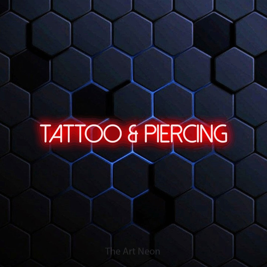LED neon sign reading “Tattoo & Piercing”, arranged in a single line.
