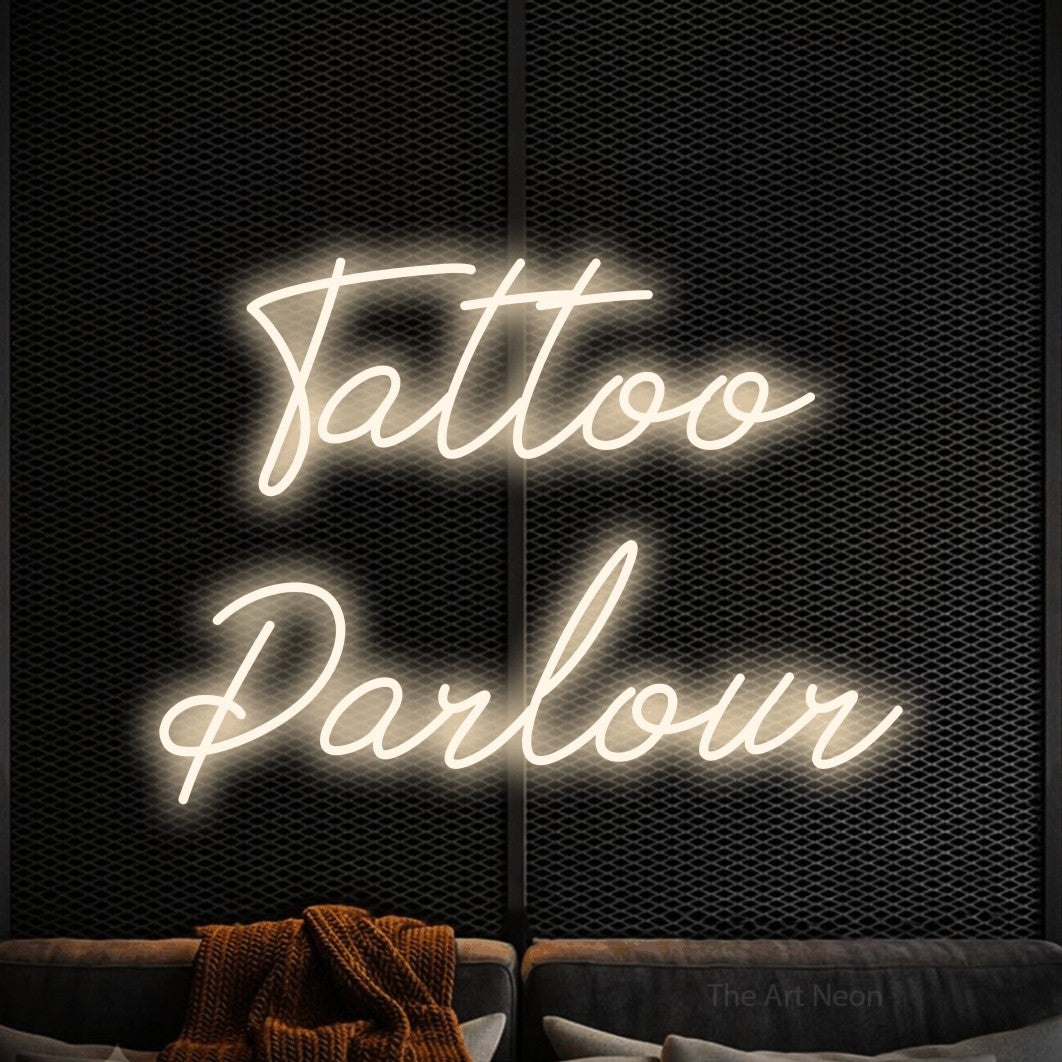 LED neon sign reading “Tattoo Parlour”, arranged in two lines.