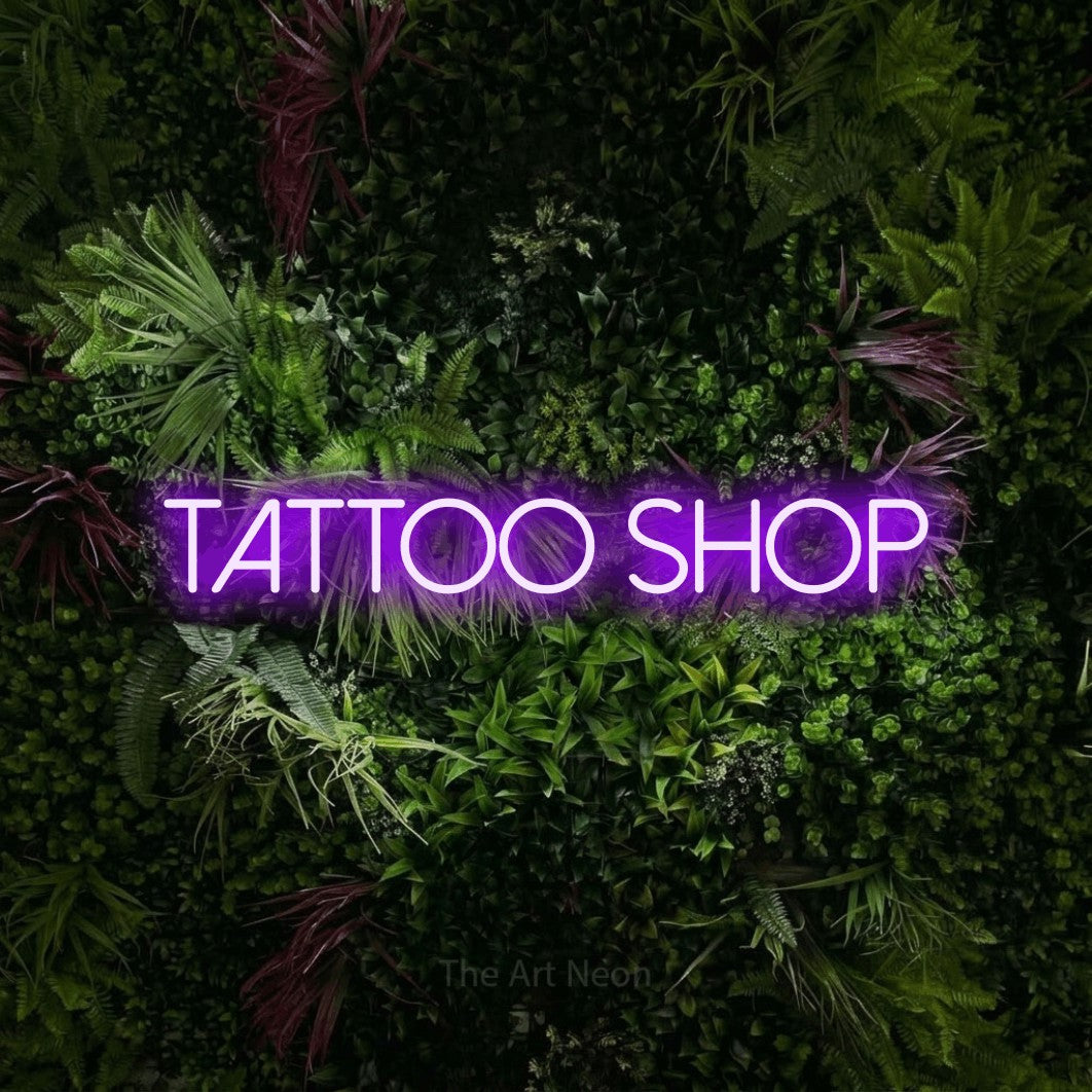 LED neon sign reading “TATTOO shop”, arranged in a single line.