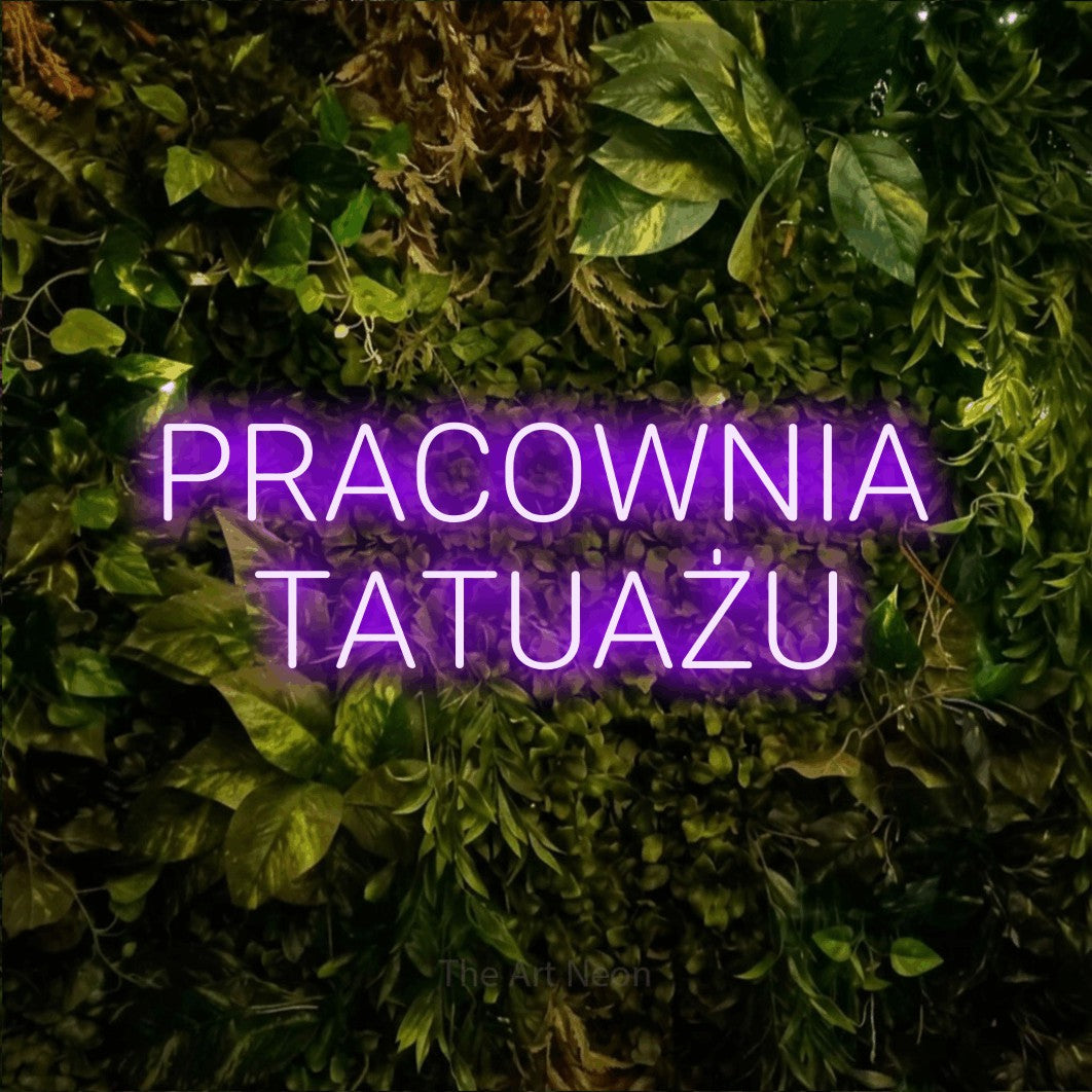 LED neon sign reading “PRACOWNIA TATUAŻU”, arranged in two lines.