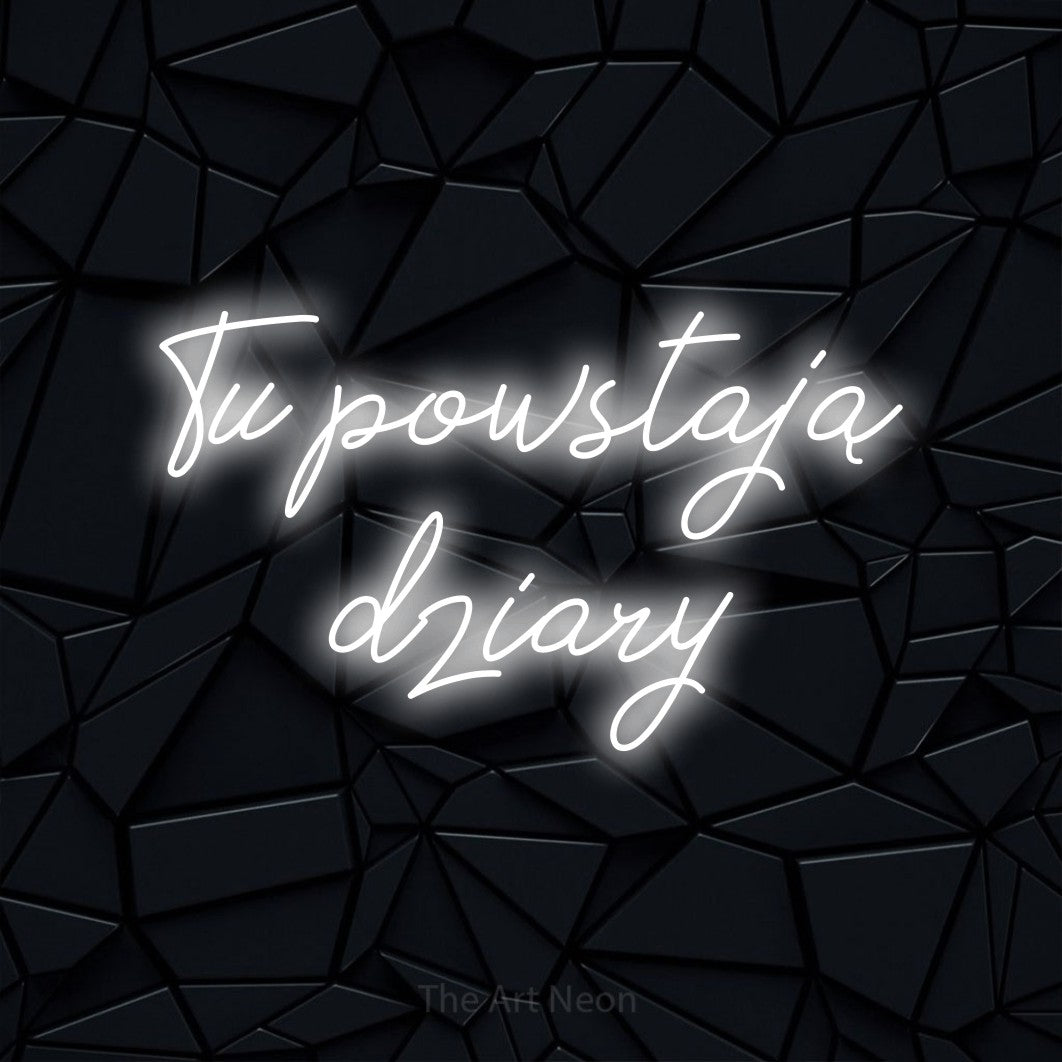 LED neon sign reading “Tu powstają dziary”, arranged in two lines.