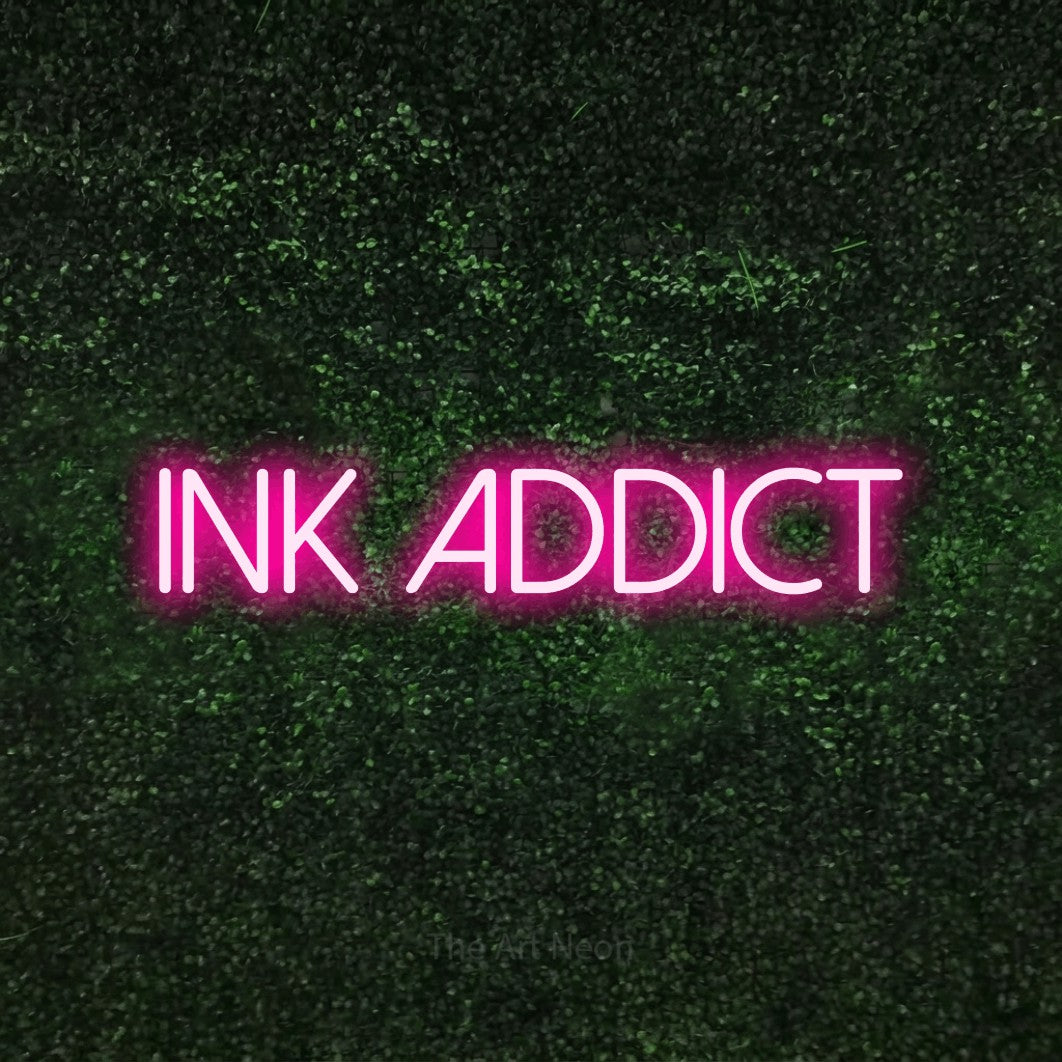 LED neon sign reading “ink addict”, arranged in a single line.