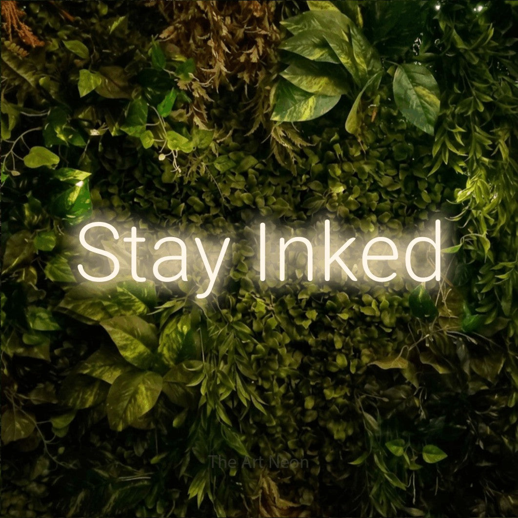 LED neon sign reading “Stay Inked”, arranged in a single line.