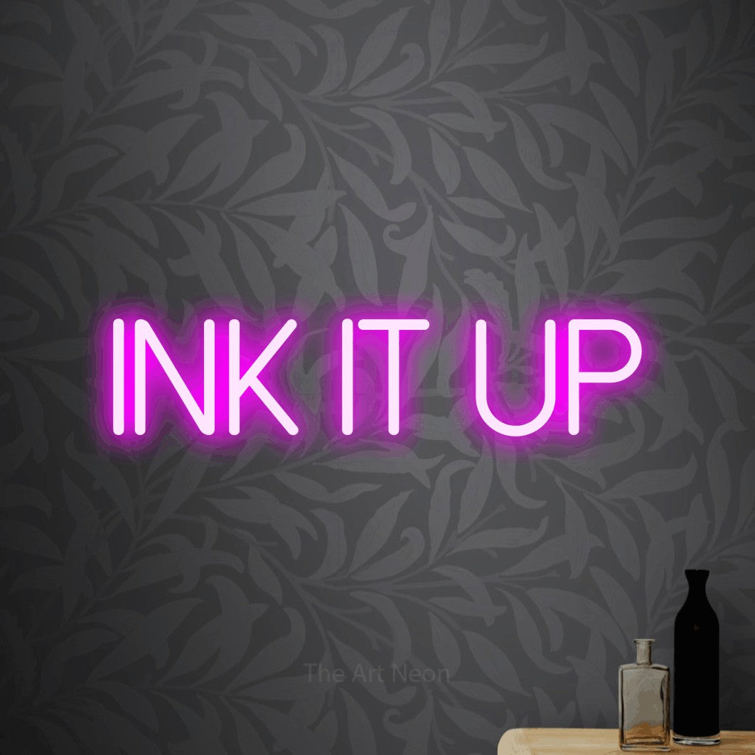 LED neon sign reading “INK it up”, arranged in a single line.