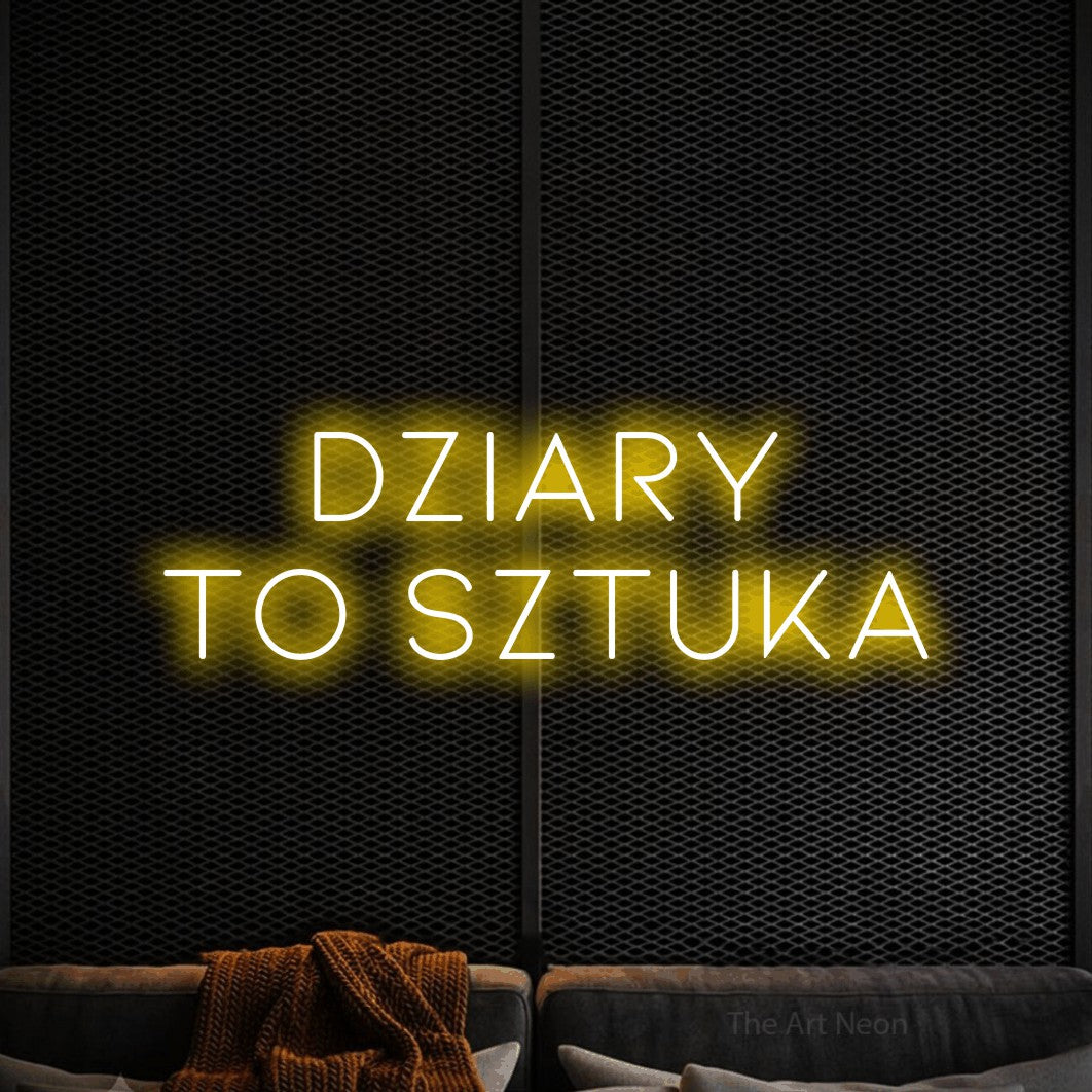 LED neon sign reading “DZIARY TO SZTUKA”, arranged in two lines.