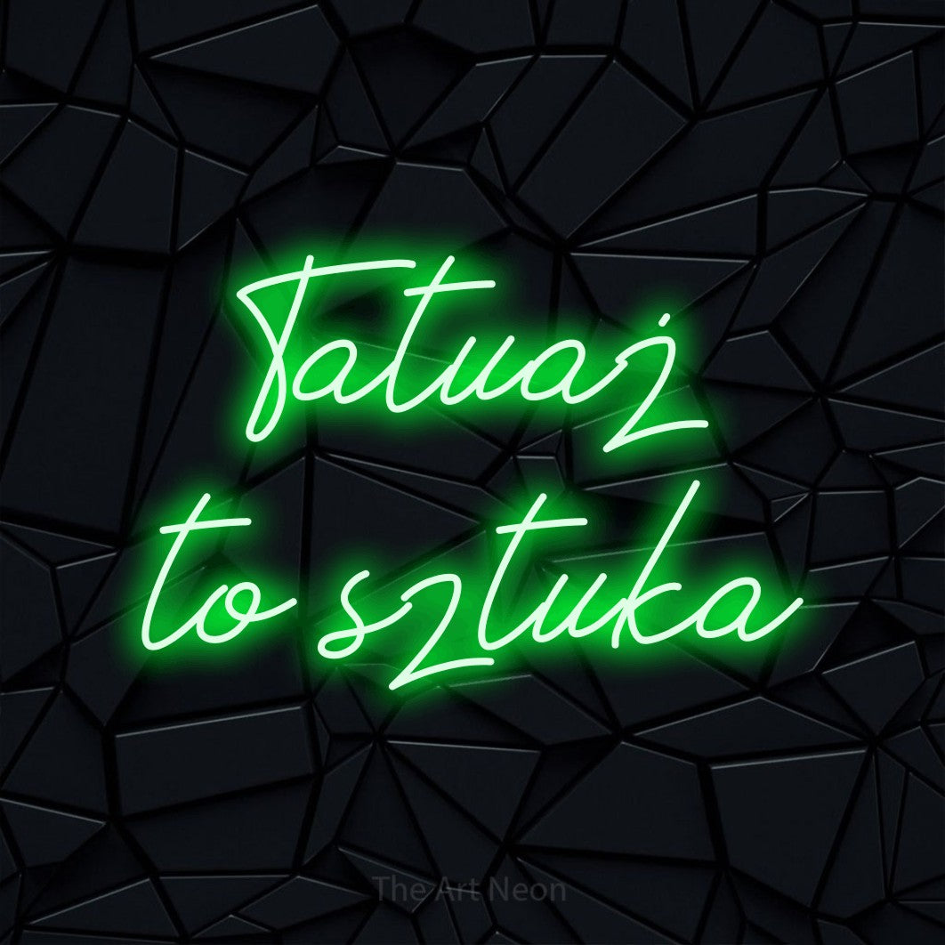 LED neon sign reading “Tatuaż to sztuka”, arranged in two lines.
