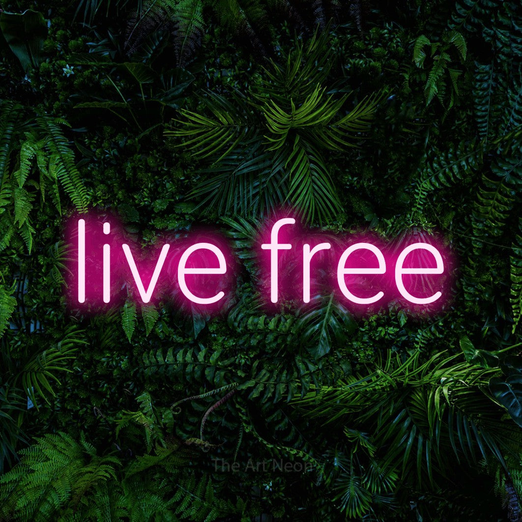 LED neon sign reading “live free”, arranged in a single line.