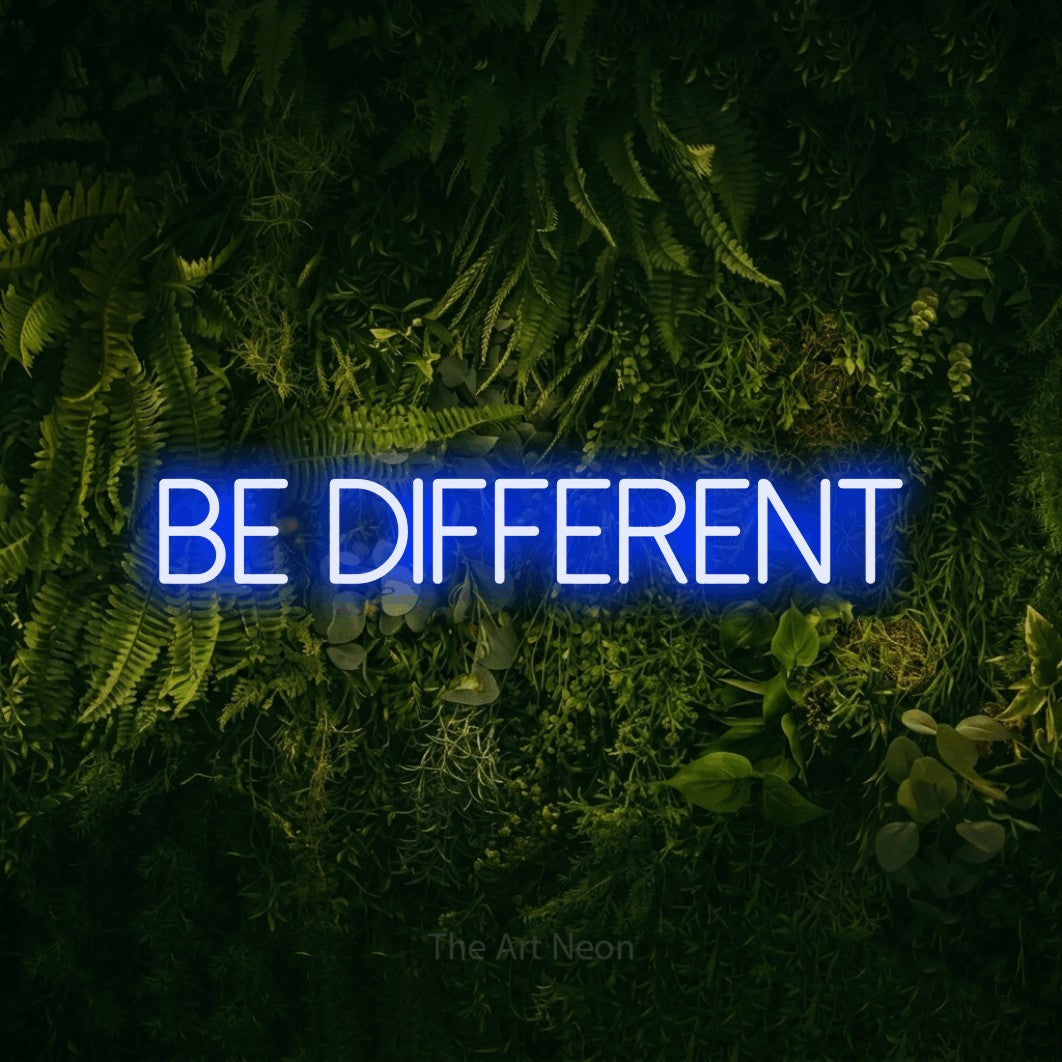LED neon sign reading “Be Different”, arranged in a single line.