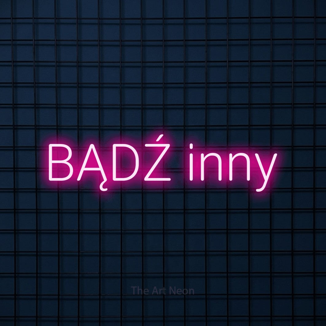 LED neon sign reading “BĄDŹ inny”, arranged in a single line.