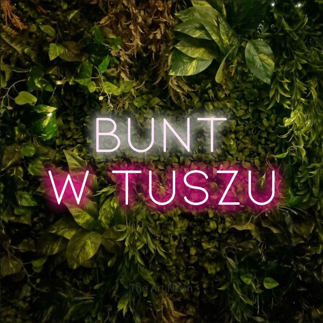 LED neon sign reading “BUNT W TUSZU”, arranged in two lines.