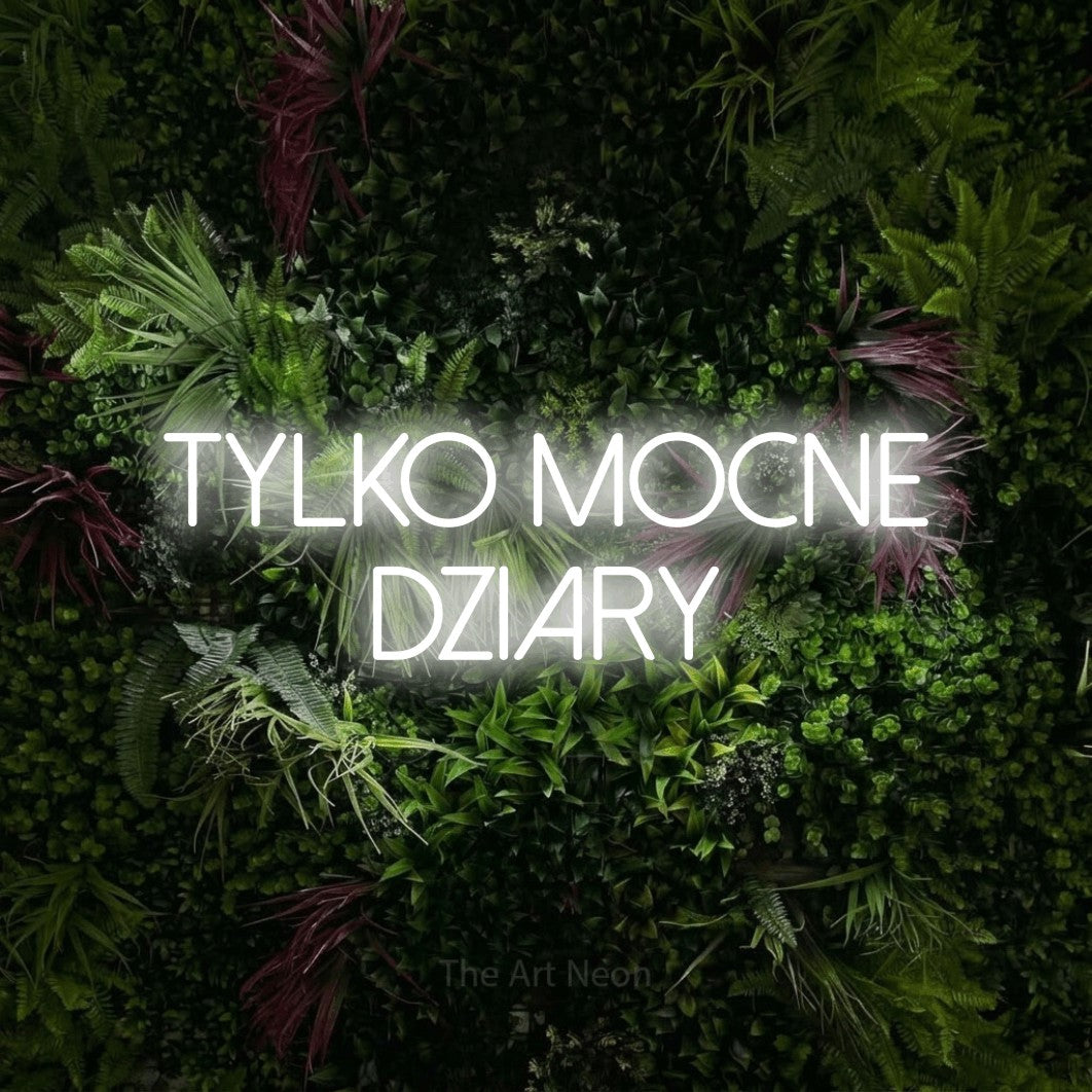 LED neon sign reading “tylko mocne dziary”, arranged in two lines.