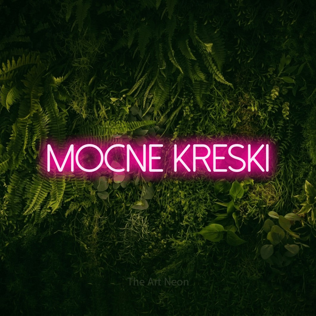 LED neon sign reading “Mocne Kreski”, arranged in a single line.