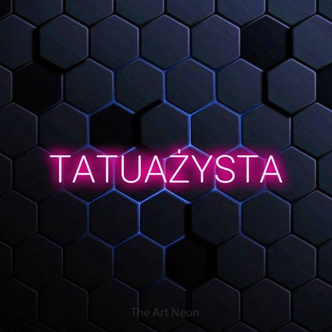 LED neon sign reading “TATUAŻYSTA”, arranged in a single line.