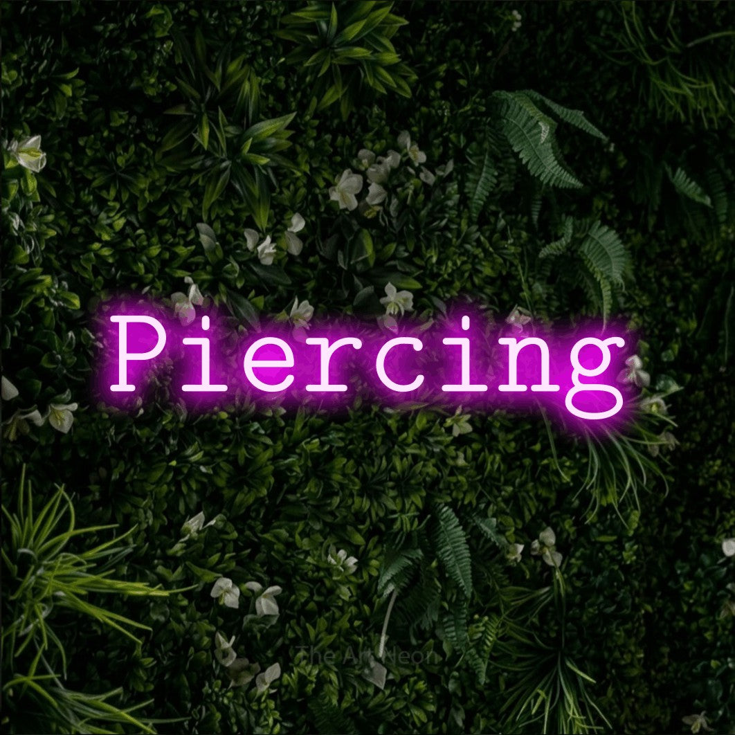 LED neon sign reading “Piercing”, arranged in a single line.