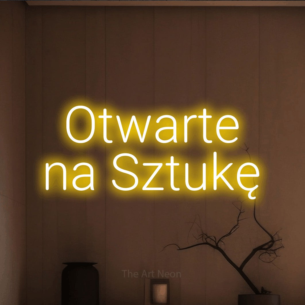 LED neon sign reading “Otwarte na Sztukę”, arranged in two lines.
