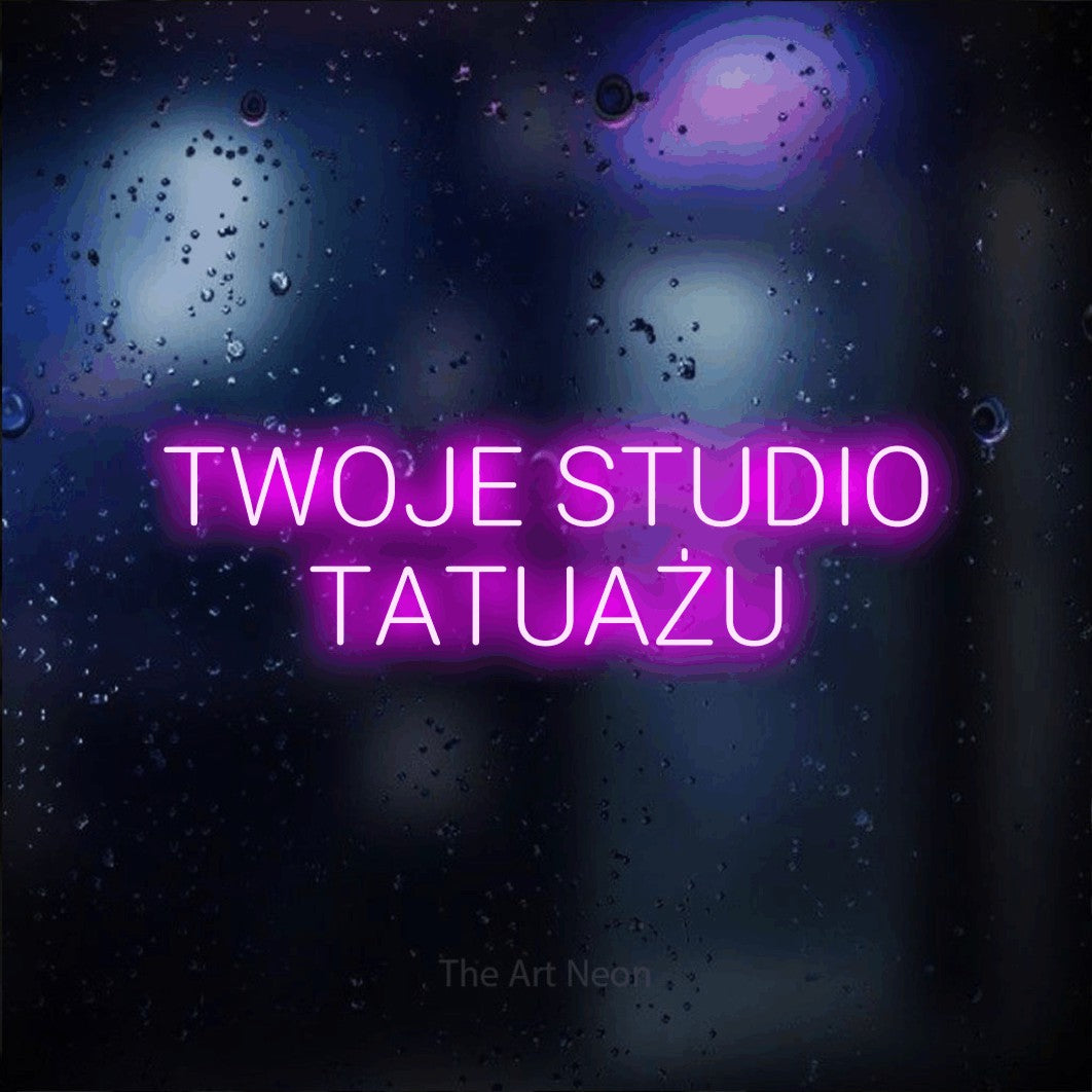 LED neon sign reading “TWOJE STUDIO TATUAŻU”, arranged in two lines.