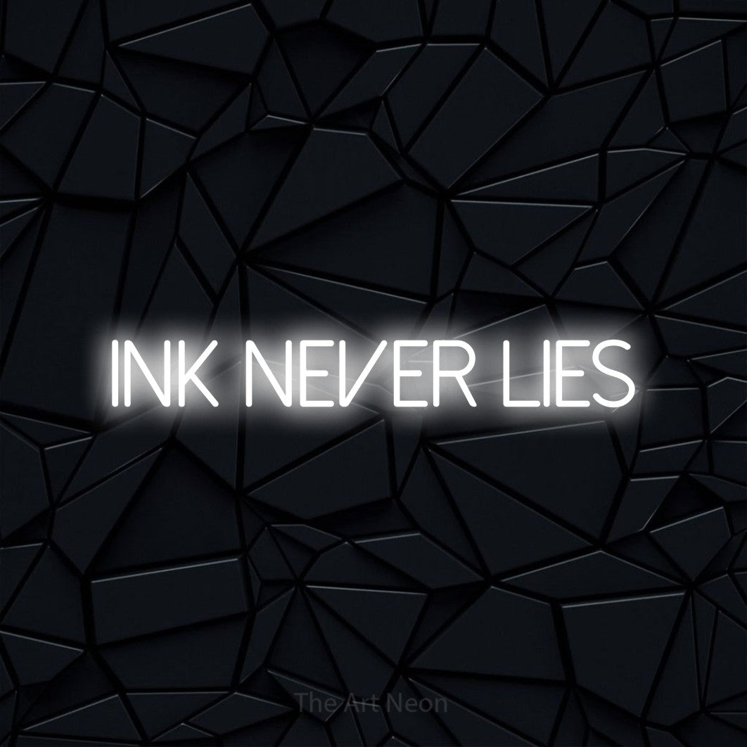 LED neon sign reading “ink NEVER lies”, arranged in a single line.