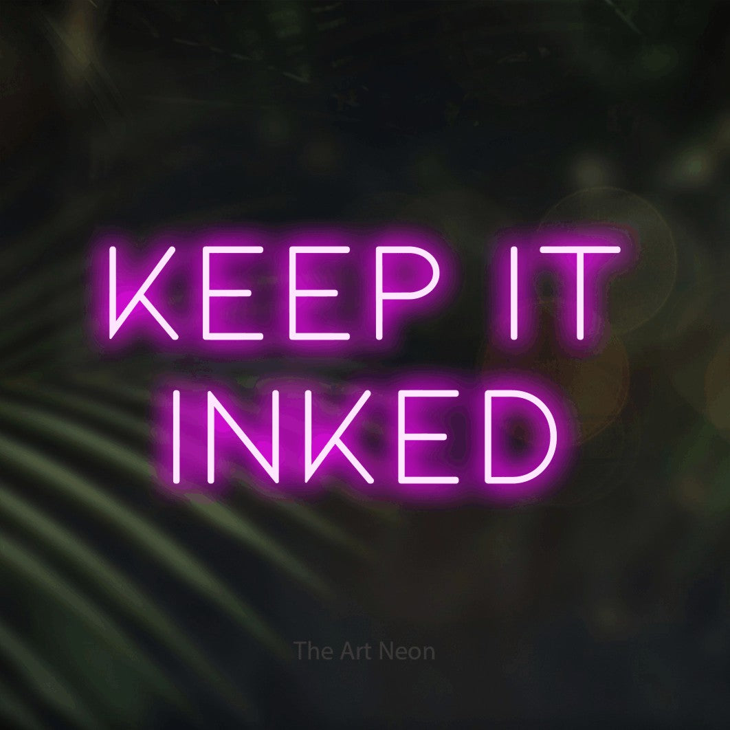 LED neon sign reading “keep it INKED”, arranged in two lines.