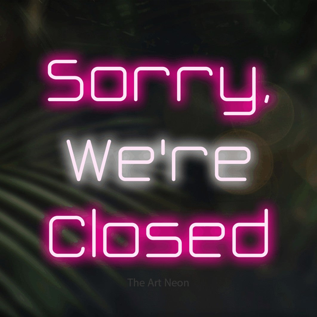 LED neon sign reading “Sorry, We're Closed”, arranged in three lines.