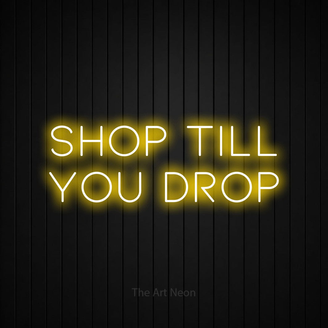 LED neon sign reading “SHOP till you drop”, arranged in two lines.