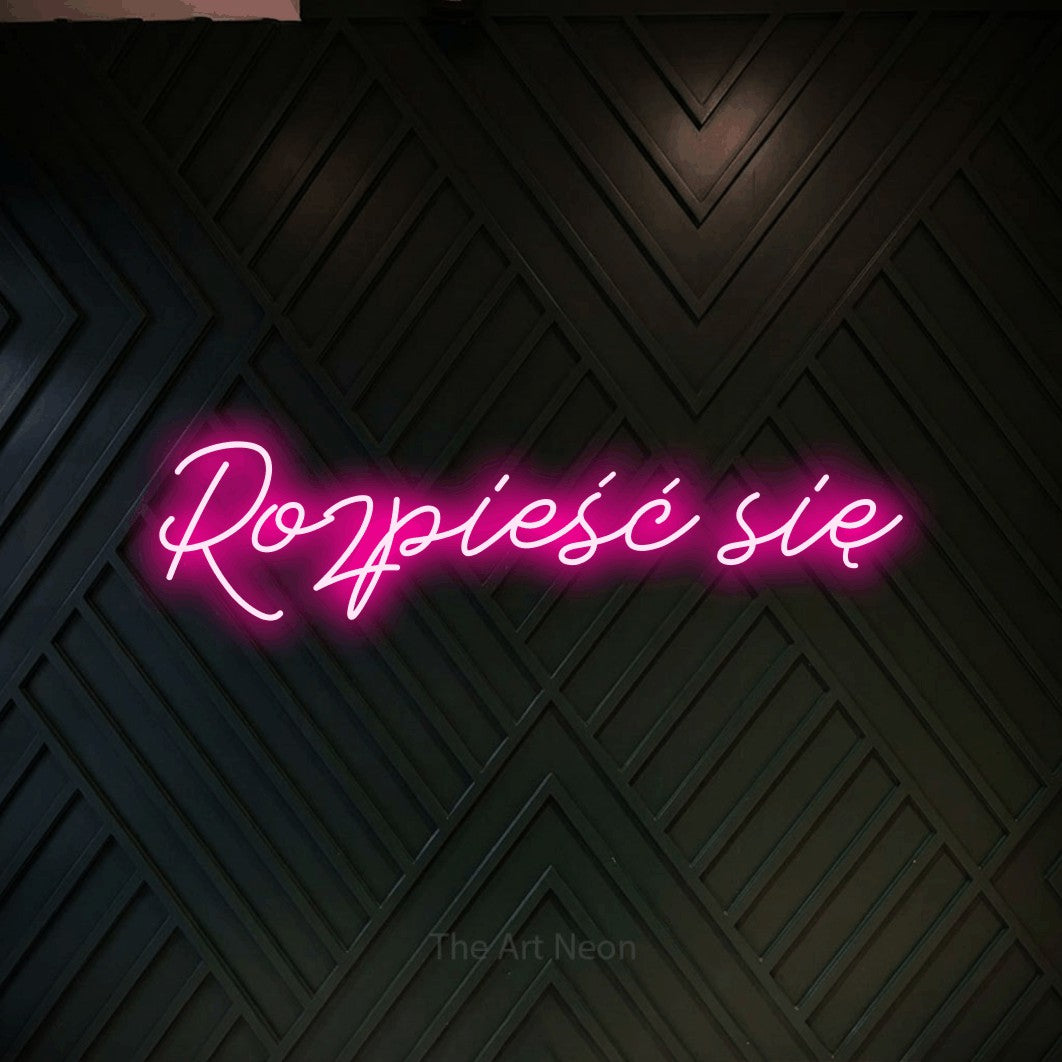 LED neon sign reading “Rozpieść się”, arranged in a single line.