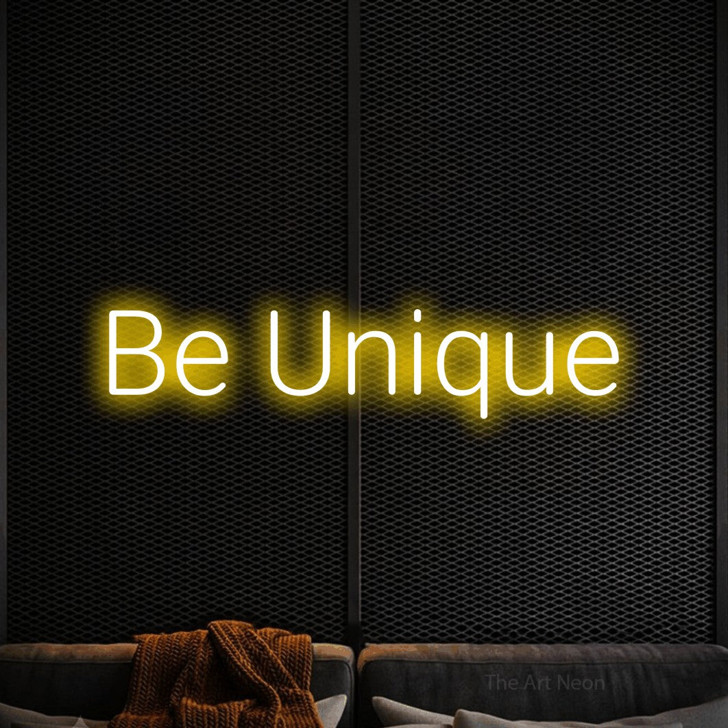 LED neon sign reading “Be Unique”, arranged in a single line.