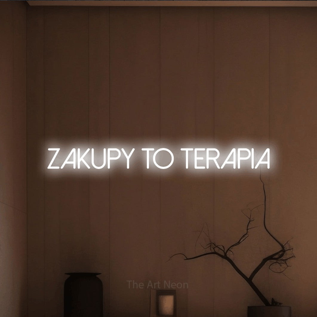 LED neon sign reading “zakupy to terapia”, arranged in a single line.