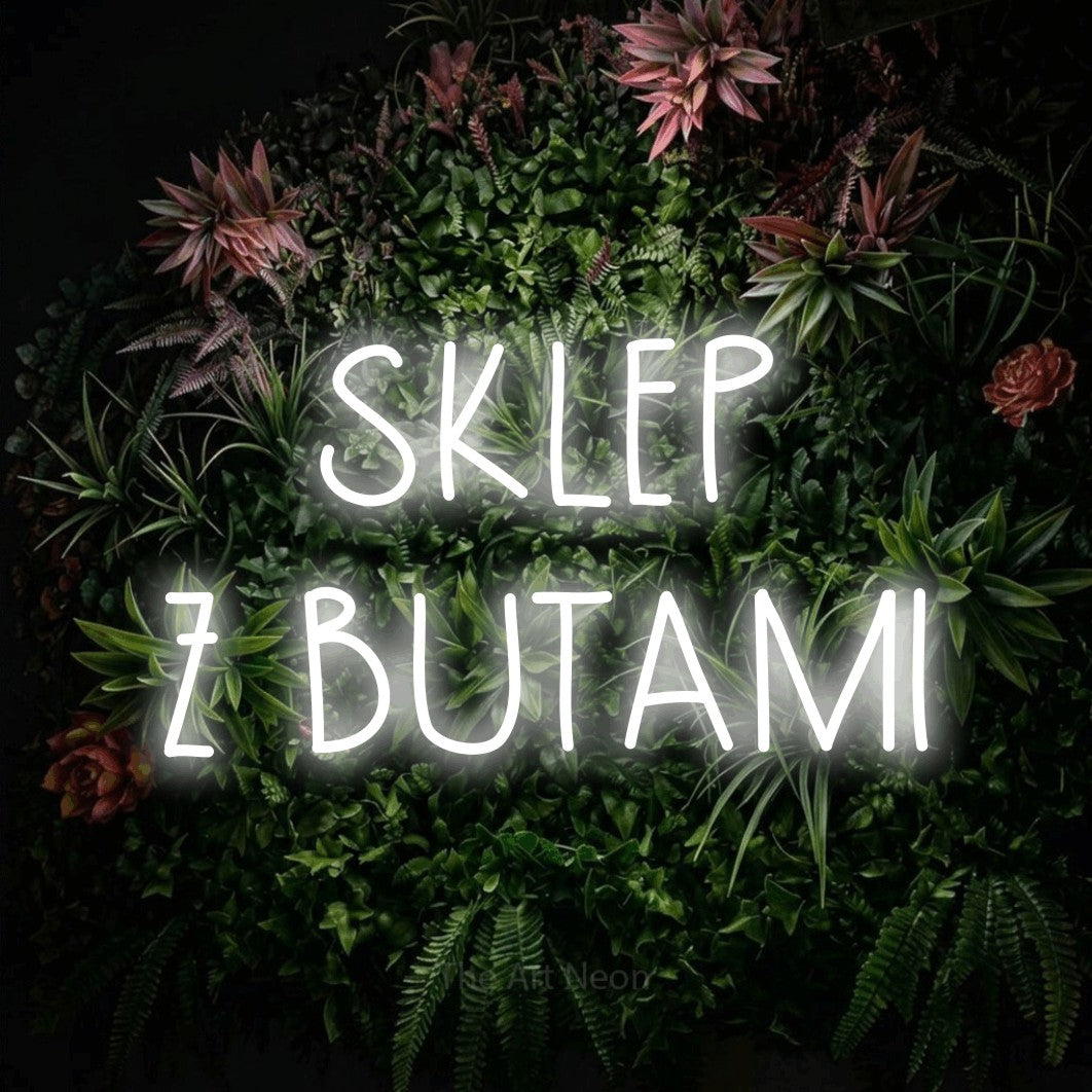 LED neon sign reading “SKLEP Z BUTAMI”, arranged in two lines.