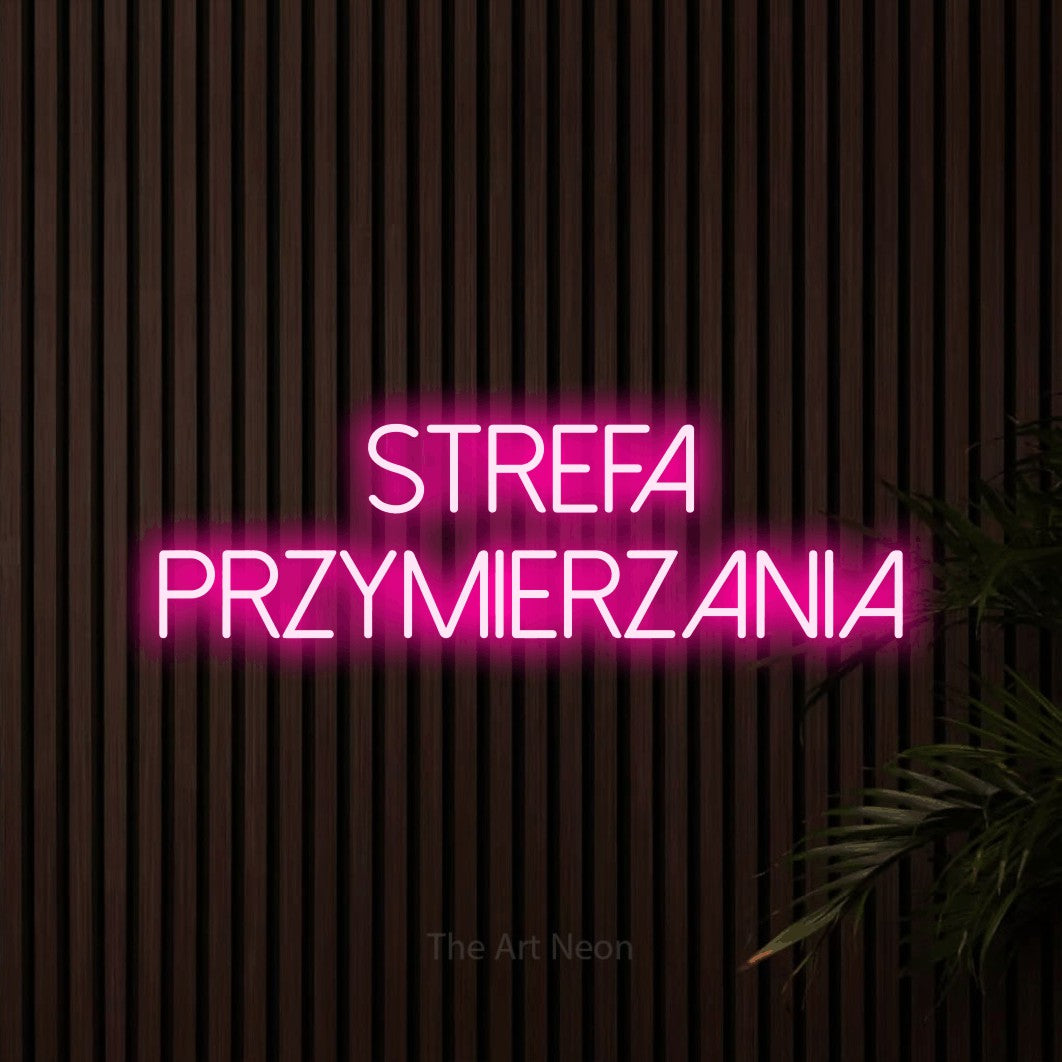 LED neon sign reading “Strefa przymierzania”, arranged in two lines.