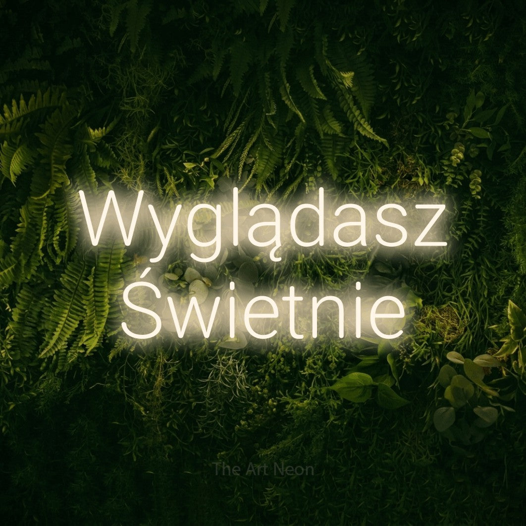 LED neon sign reading “Wyglądasz Świetnie”, arranged in two lines.