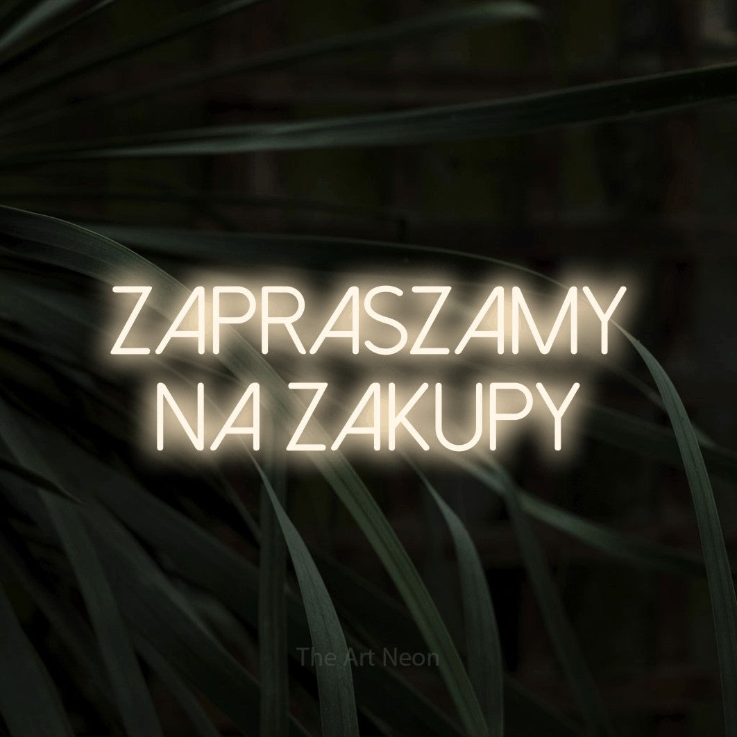 LED neon sign reading “zapraszamy na zakupy”, arranged in two lines.