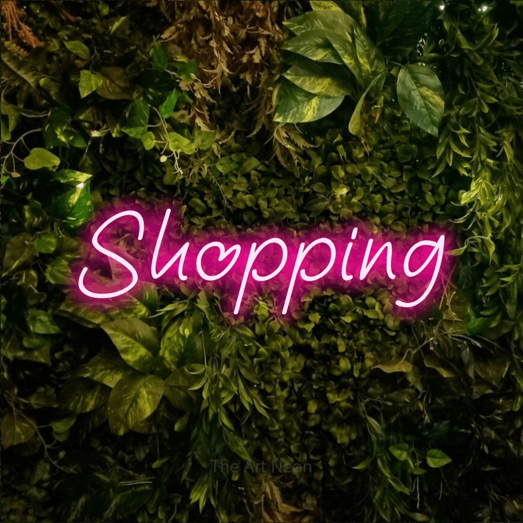 LED neon sign reading “Shopping”, arranged in a single line.