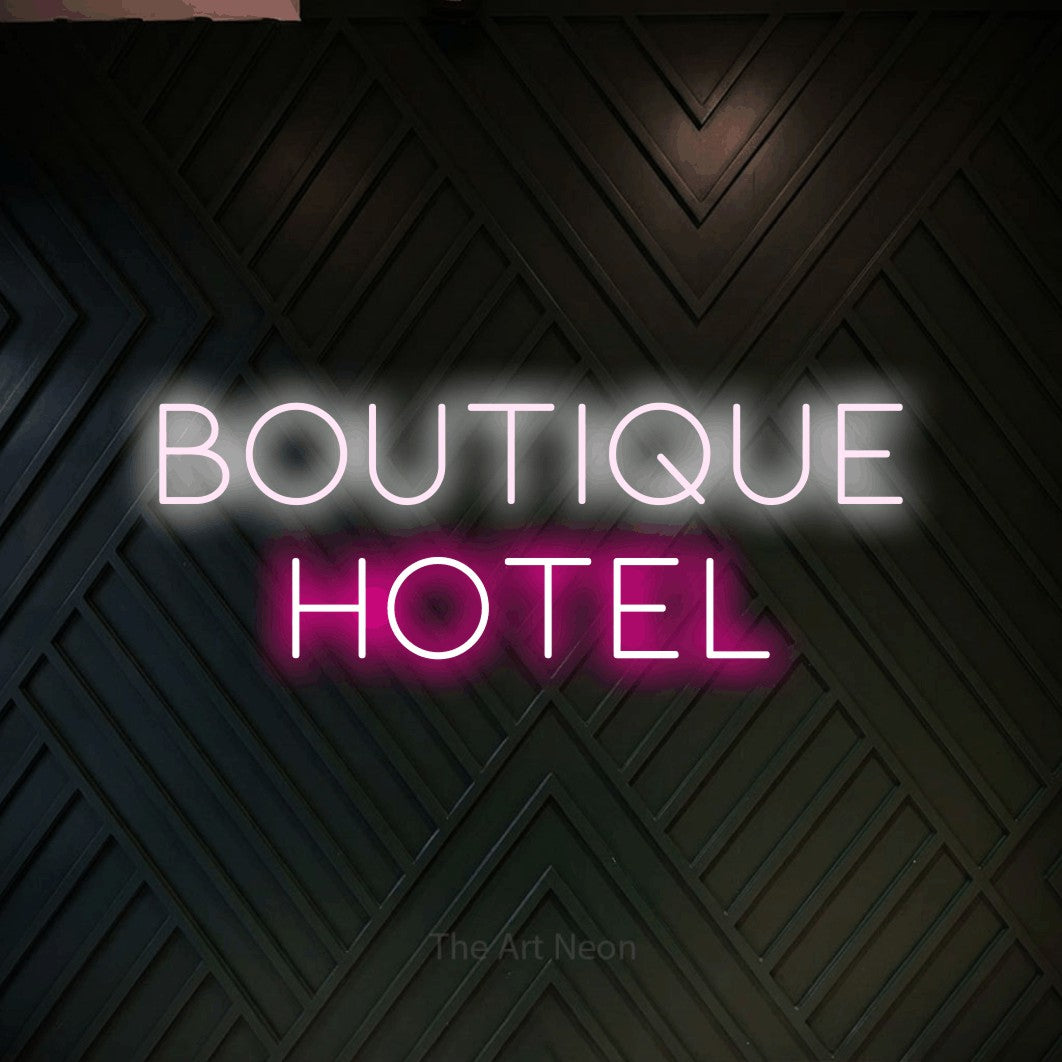LED neon sign reading “BOUTIQUE HOTEL”, arranged in two lines.