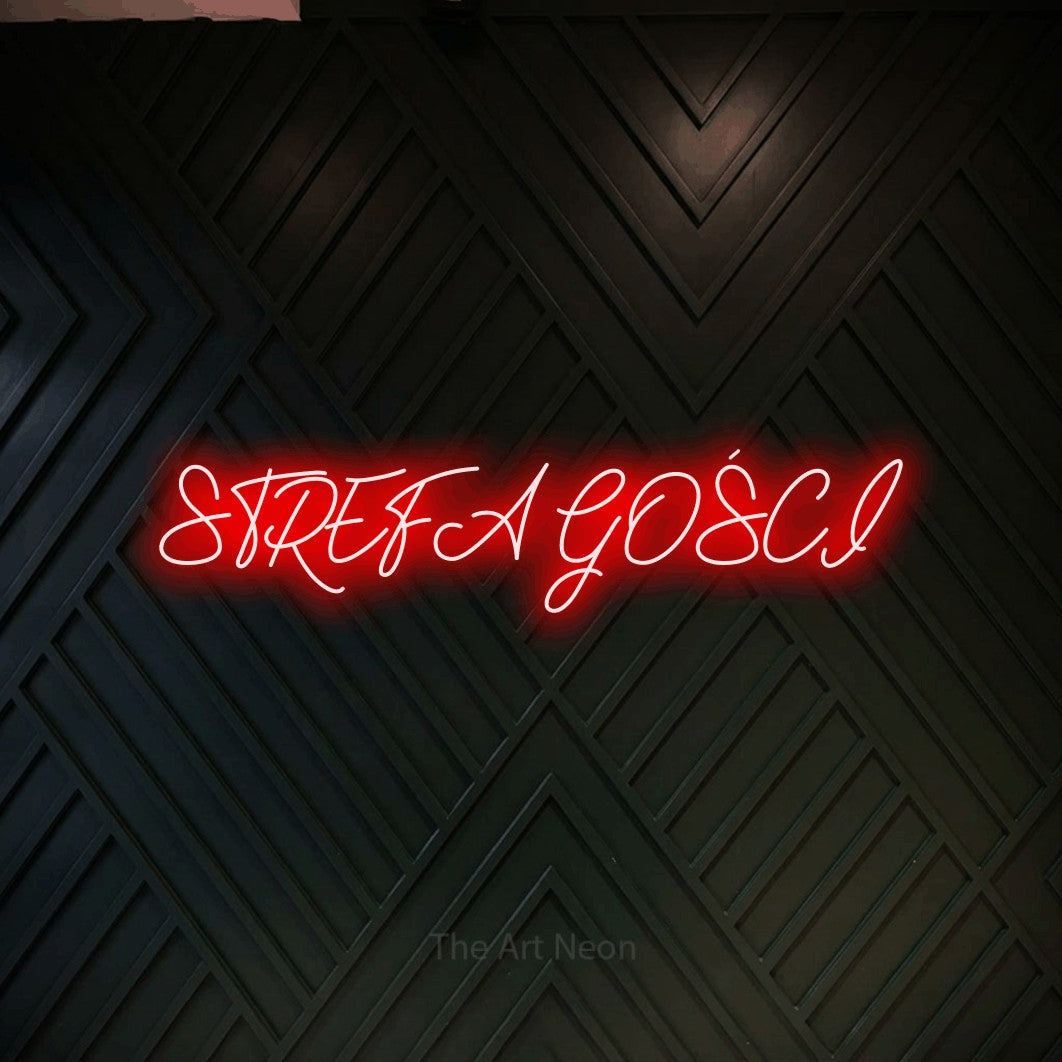 LED neon sign reading “STREFA GOŚCI”, arranged in a single line.