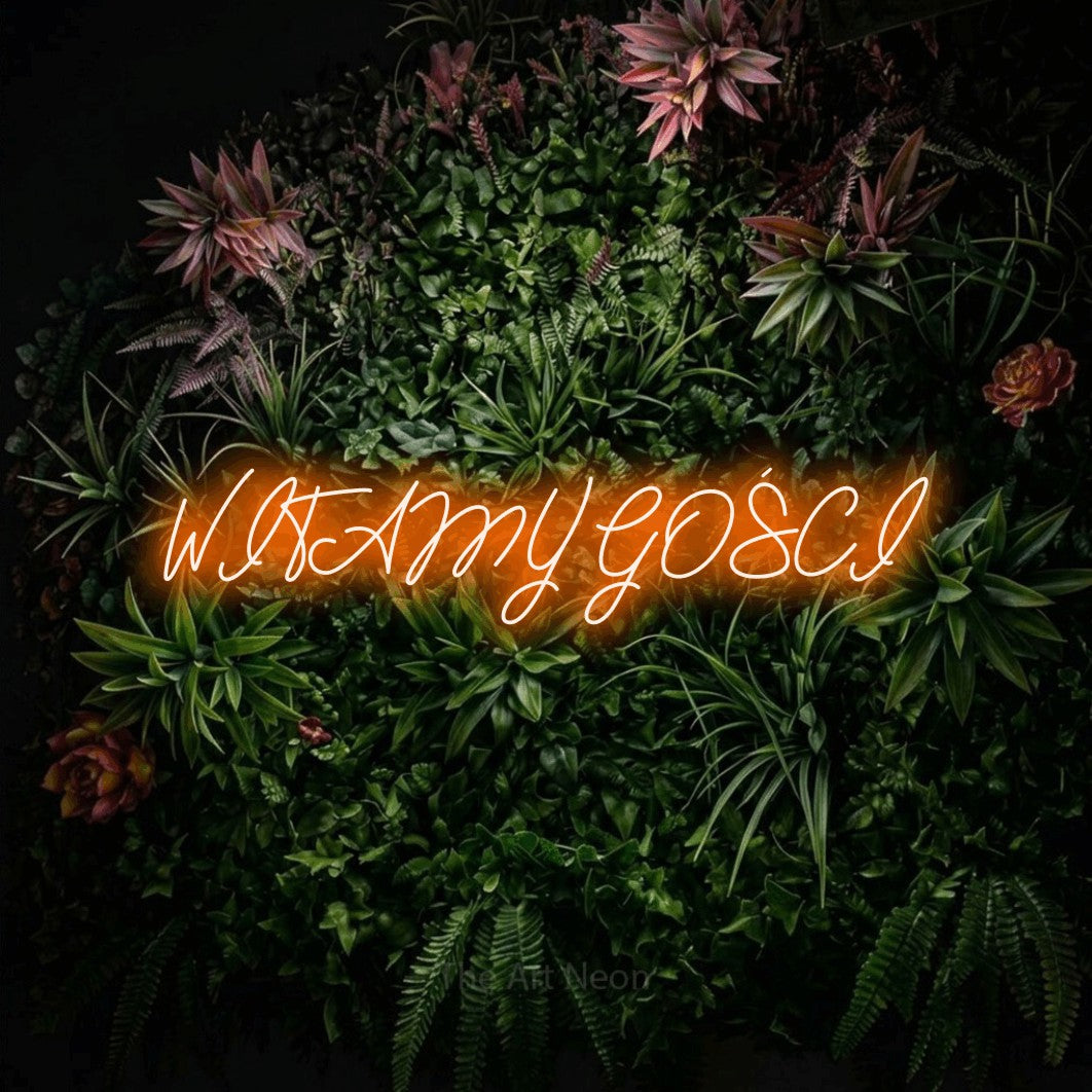 LED neon sign reading “WITAMY GOŚCI”, arranged in a single line.
