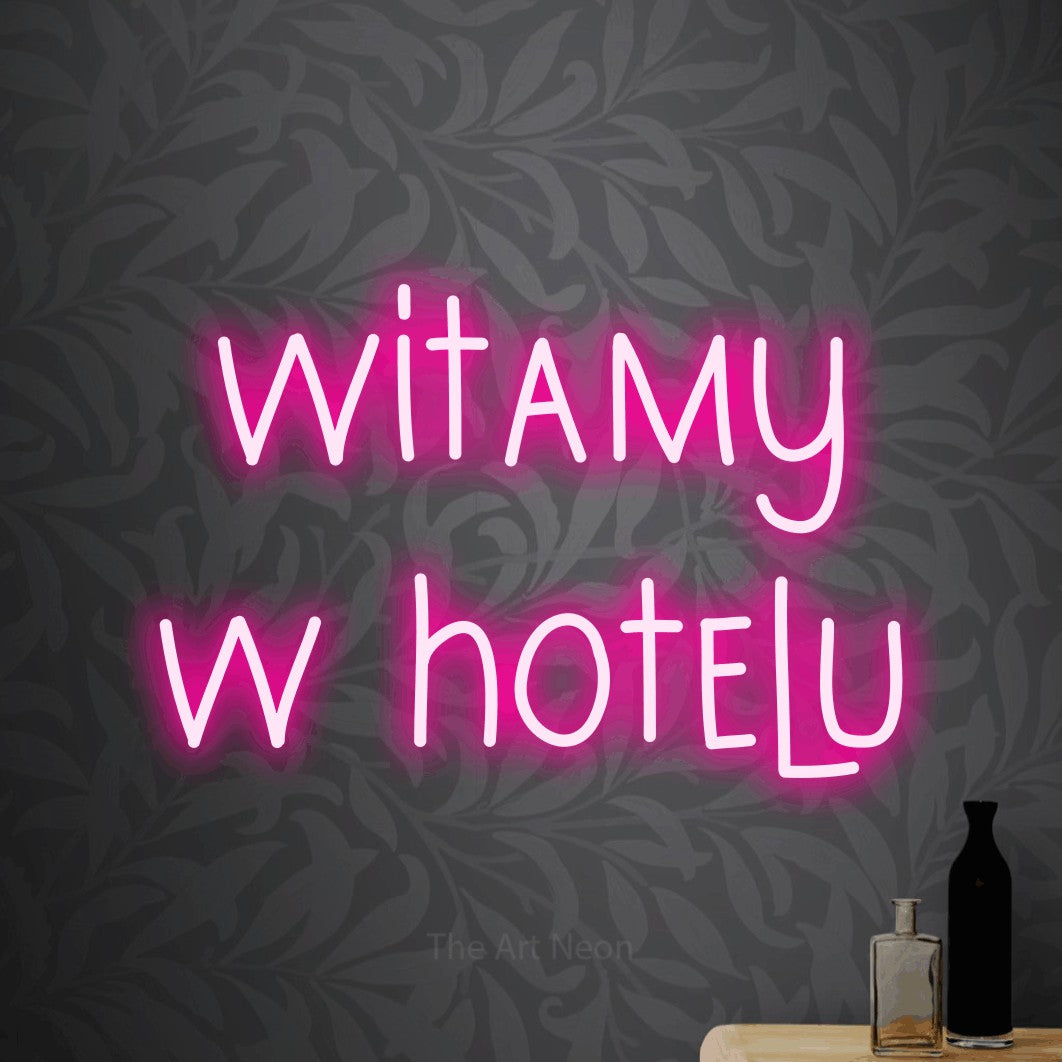 LED neon sign reading “witamy w hotelu”, arranged in two lines.
