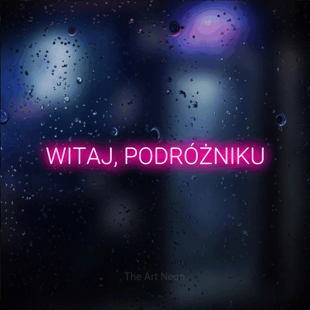 LED neon sign reading “WITAJ, PODRÓŻNIKU”, arranged in a single line.