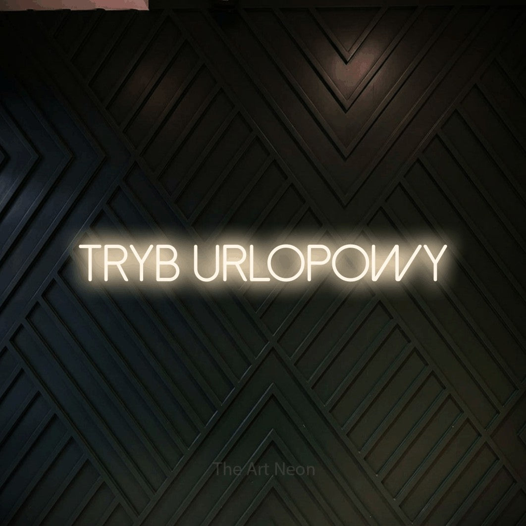 LED neon sign reading “TRYB URLOPOWY”, arranged in a single line.