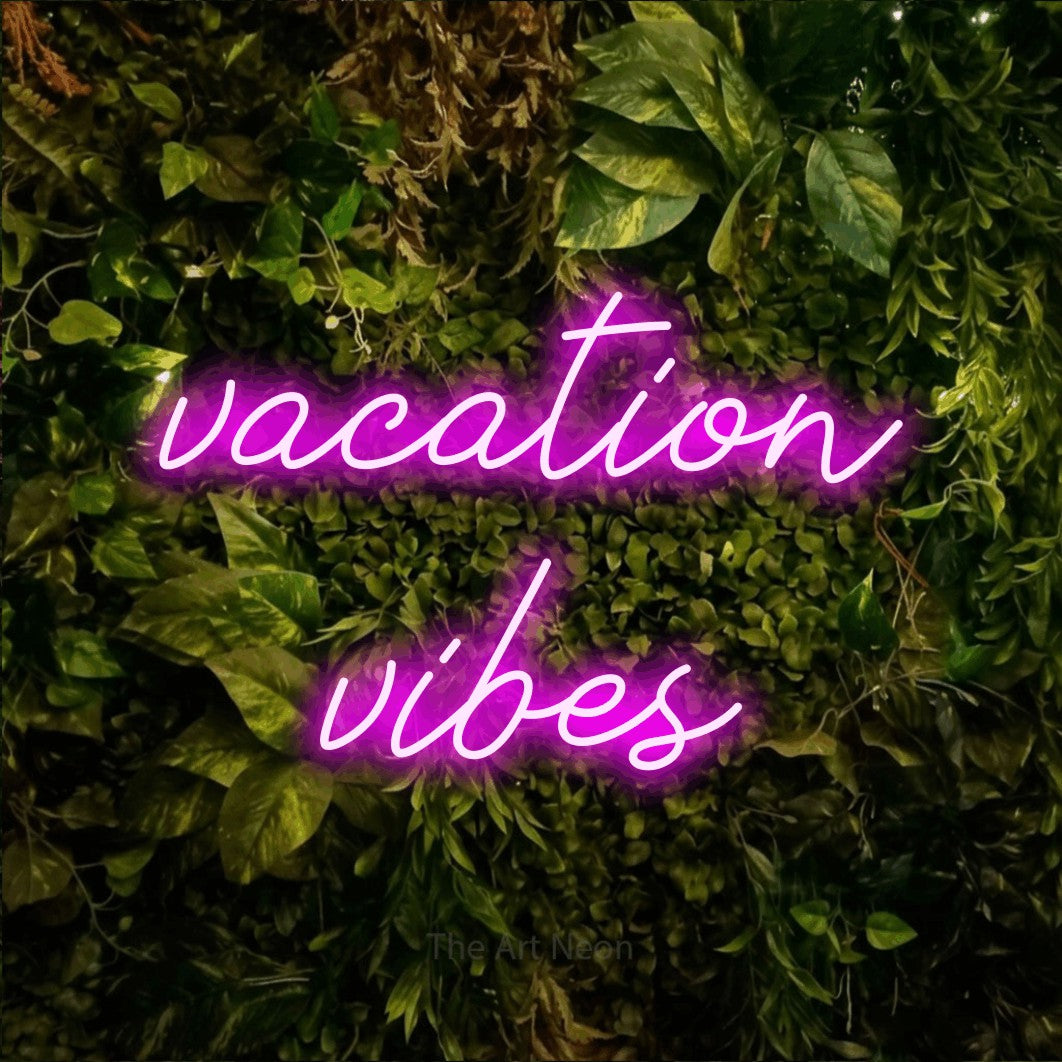 LED neon sign reading “vacation vibes”, arranged in two lines.