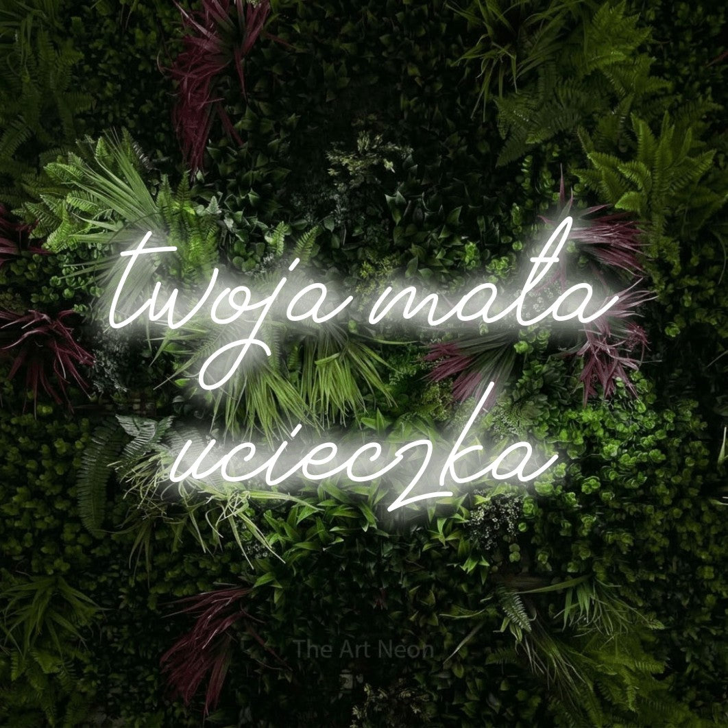 LED neon sign reading “twoja mała ucieczka”, arranged in two lines.