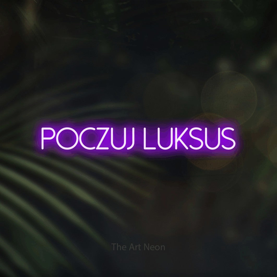 LED neon sign reading “Poczuj luksus”, arranged in a single line.
