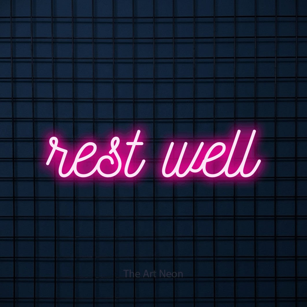 LED neon sign reading “rest well”, arranged in a single line.
